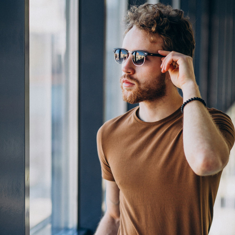 young-handsome-man-standing-by-window-airport_46